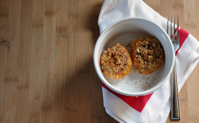 Roasted peaches with vanilla wafer, almond, and brown sugar crumble