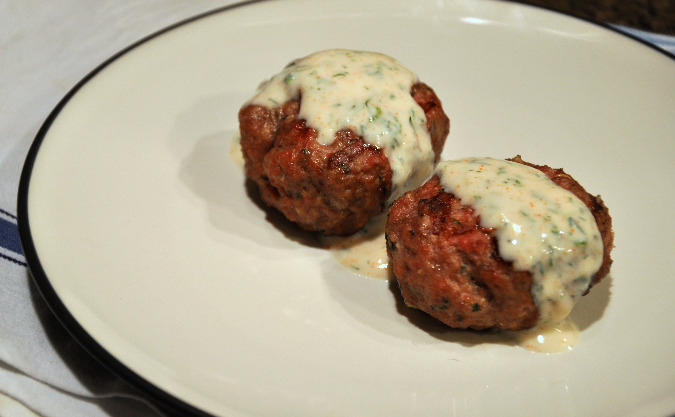 Lamb sausage with mint, feta, and garlic and dill garlic yogurt sauce