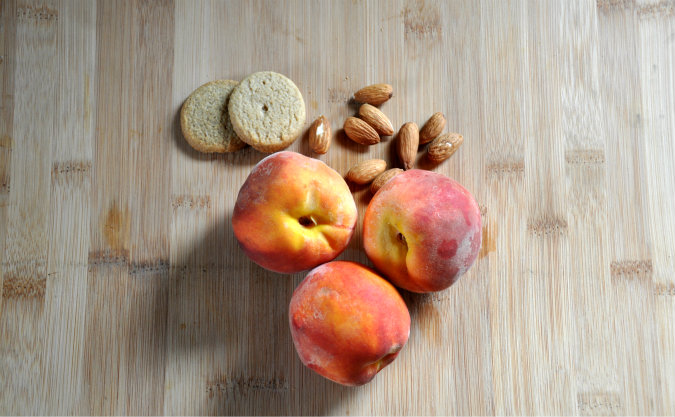 Roasted peaches with vanilla wafer, almond, and brown sugar crumble