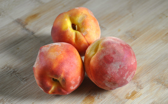 Roasted peaches with vanilla wafer, almond, and brown sugar crumble