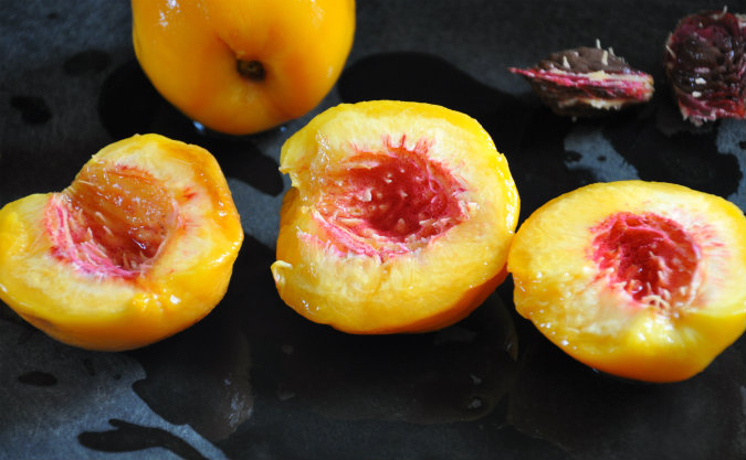 Roasted peaches with vanilla wafer, almond, and brown sugar crumble