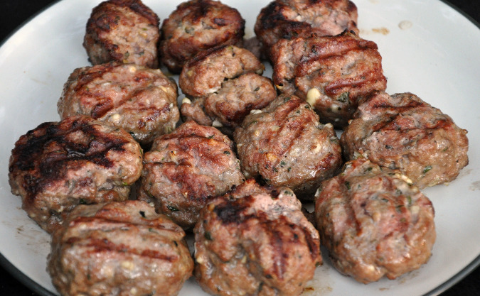 Lamb sausage with mint, feta, and garlic and dill garlic yogurt sauce